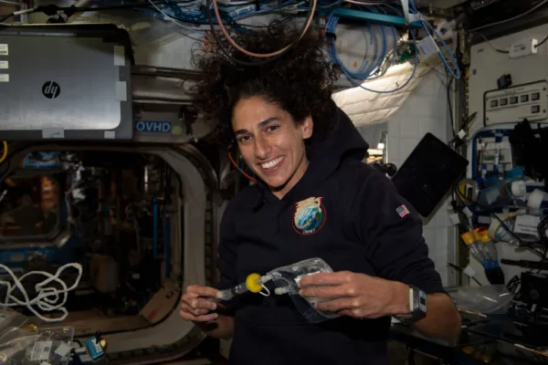 iss069e085932_alt (Sept. 4, 2023) --- NASA astronaut and Expedition 69 Flight Engineer Jasmin Moghbeli collects water samples for microbial analysis inside the International Space Station